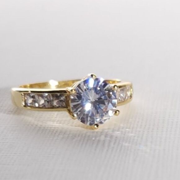 Simulated White Diamond Ring in a Goldtone Ring Size 8 - Picture 1 of 9